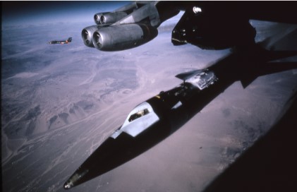Maj. Robert White drops away from the NB-52B mothership on 9 November 1961 on what would become the first Mach 6 flight by any aircraft. (NASA Photo) 